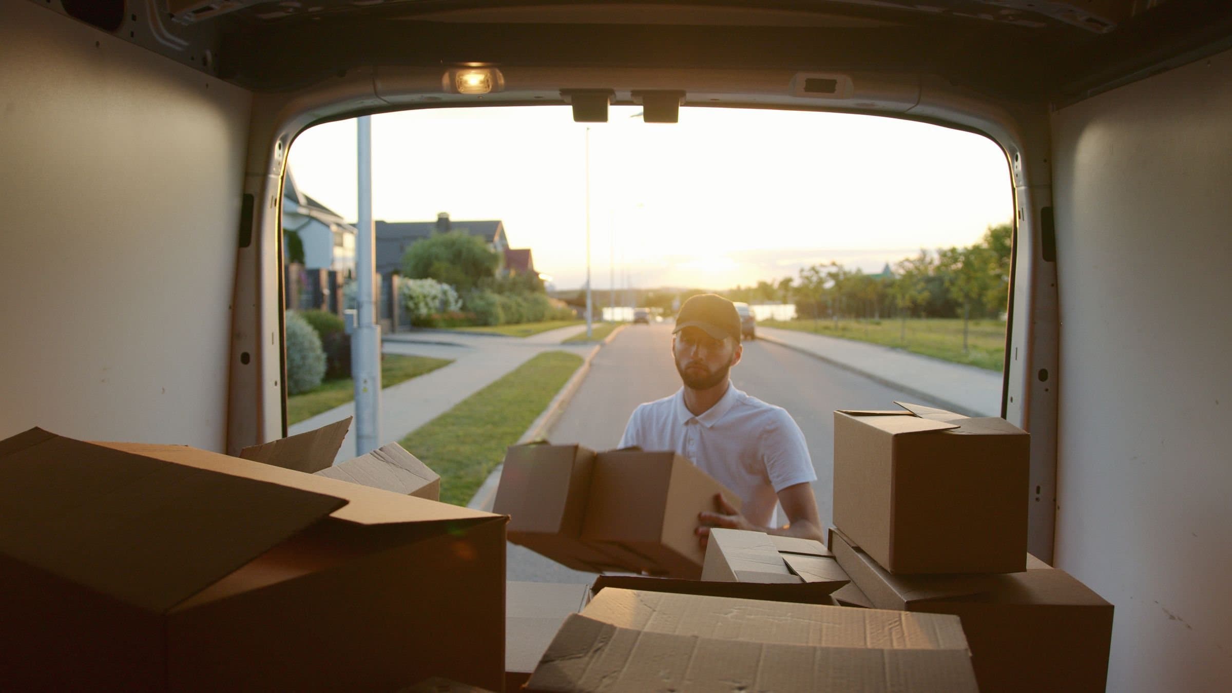 Household boxes being loaded into a van